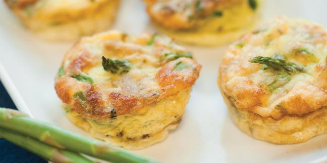 A plate of home-made mini-frittatas with asparagus, spinach, and chicken sausage
